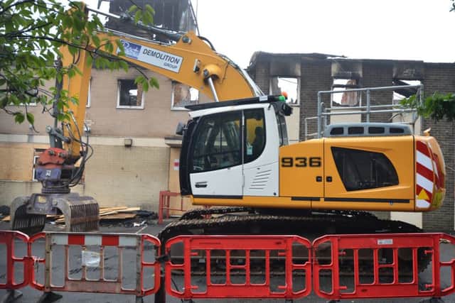 A bulldozer outside the former Mount Denys Care Home