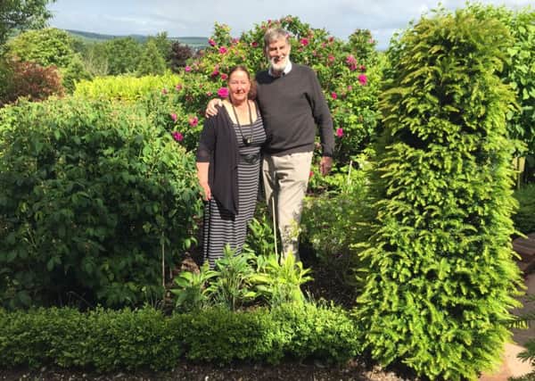 Bill and Rosemary Tustin in their beautiful garden