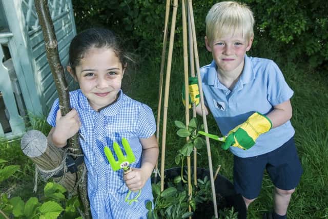East Preston Infants School pupils Hollie and Charlie with tools donated by CALA Homes