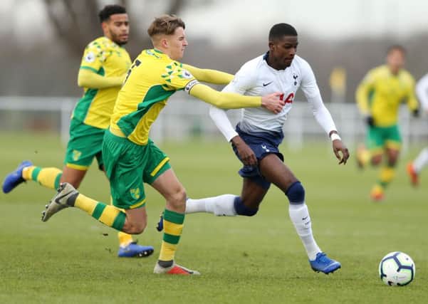 NORWICH, ENGLAND - JANUARY 18:  Shilow Tracey of Tottenham Hotspur is pulled back by Ciaren Jones of Norwich City during the Premier League International Cup match between Norwich City and Tottenham Hotspur U23 on January 18, 2019 in Norwich, England. (Photo by Paul Harding/Getty Images) SUS-190606-110945002