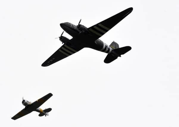 D-Day 75th Anniversary -The legendary Dakota and Douglas DC-3 aircraft fly past over Beachy Head (Photo by Jon Rigby) SUS-190606-104228001
