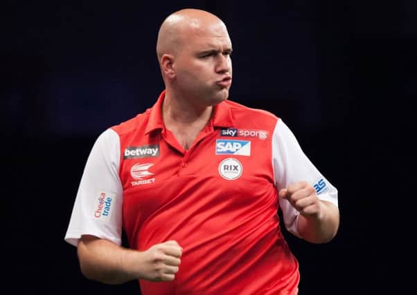 Rob Cross in action at last year's World Cup. Picture courtesy PDC