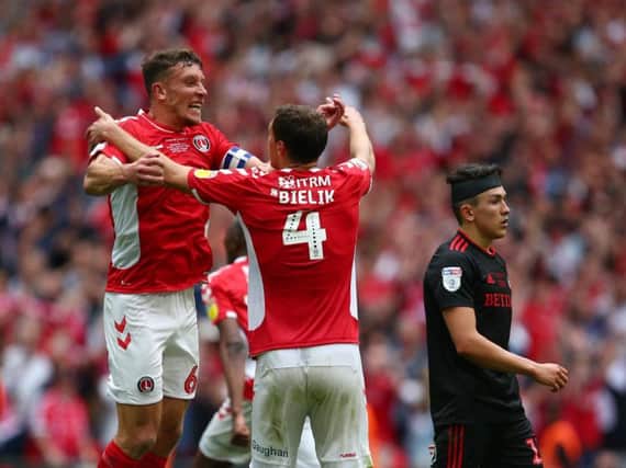 Jason Pearce and Krystian Bielik of Charlton Athletic celebrate at the final whistle during the Sky Bet League One Play-off Final (Photo by Charlie Crowhurst/Getty Images)