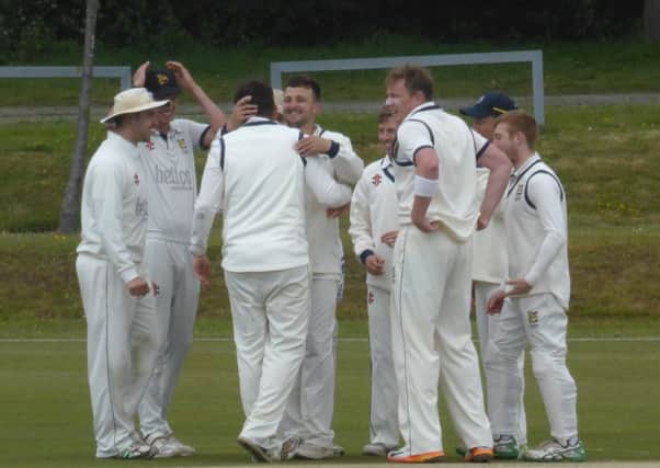 Hastings Priory Cricket Club celebrates an early wicket against Burgess Hill