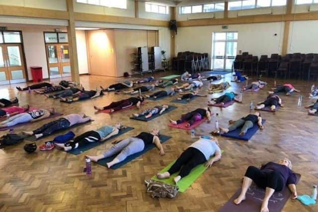 A charity yoga class in Horsham raised more than £600 in an hour SUS-191106-152617001