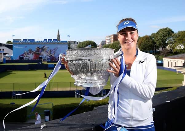 Belinda Bencic poses with the trophy after defeating Agnieszka Radwanska in the 2015 final at Devonshire Park