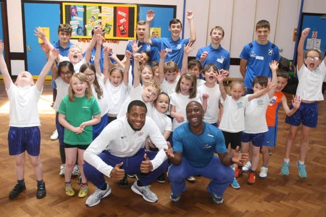 DM1961697a.jpg. Nathan Fox, left and Adrian Patrick, Commonwealth gold medallists visit Springfield Infant School, Worthing. Photo by Derek Martin Photography. SUS-191106-175949008