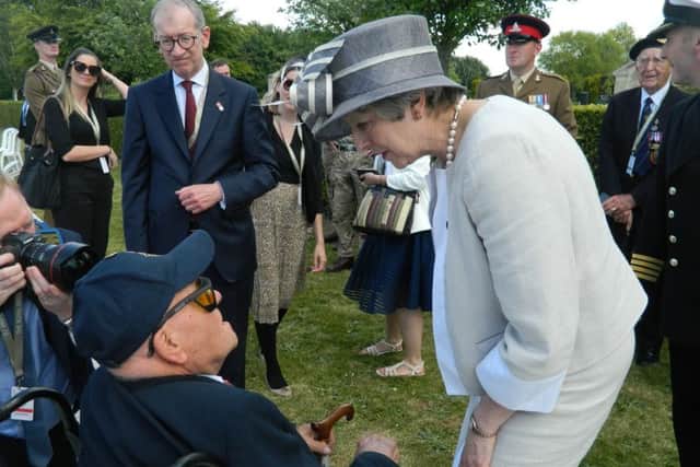 D-Day Veteran Tom Rogers meets Prime Minister Theresa May and husband Philip May SUS-191206-124552001