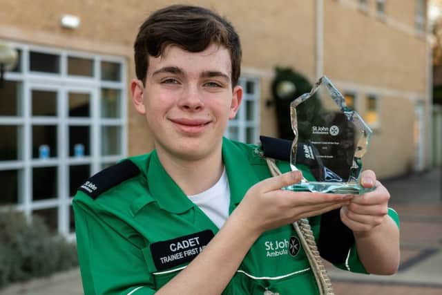 Oliver Faragher, 14, with his trophy as St John Ambulance's Regional Cadet of the Year. Picture: Brian Aldrich