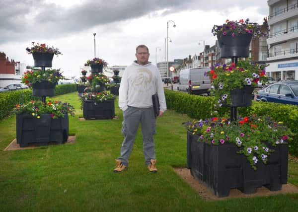 Andrew Crotty with the new plant pots in Bexhill