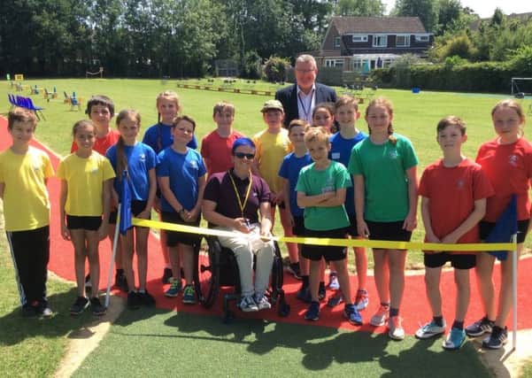 T54 British Athlete wheelchair racer Lizzie Williams opens new running track at North Heath Community Primary School