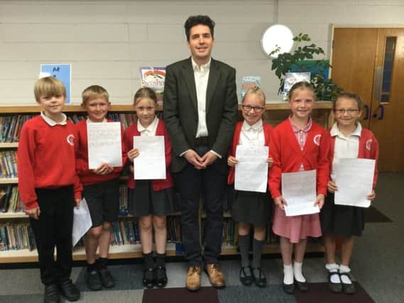 Huw Merriman MP with pupils from Battle and Langton Primary School