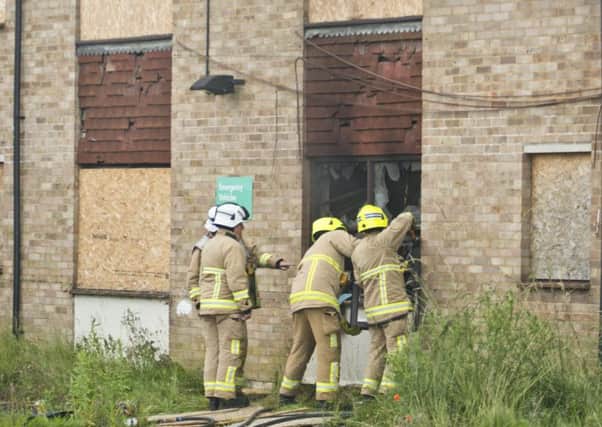 Fire crews at the derelict flats in Burgess Hill on Sunday. Photo by Eddie Howland