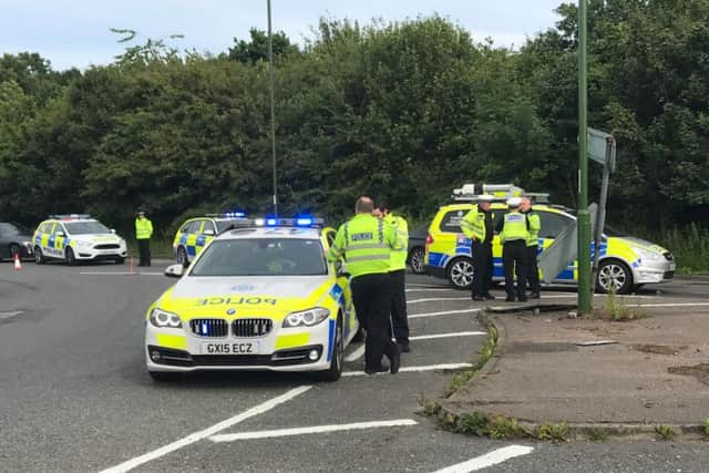 Sussex Police attend the scene on the A280