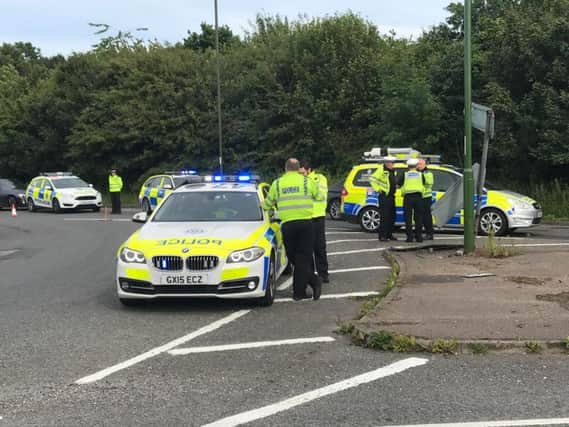 Sussex Police attend the scene on the A280