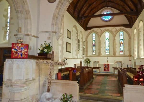 The Pentecost falls on the front of the altar and pulpit at St Marys Church in Clymping