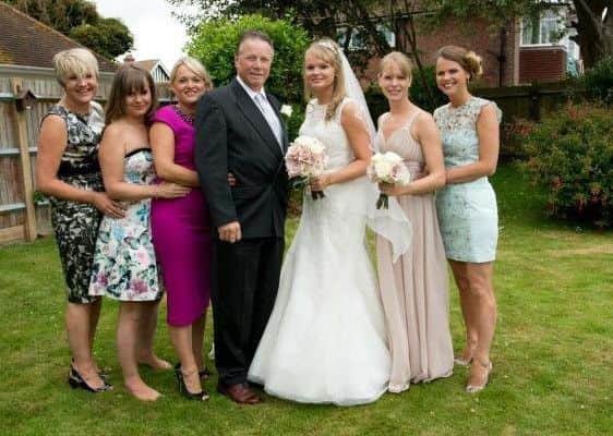 All six of the Spriggs daughters with their father, Bill
