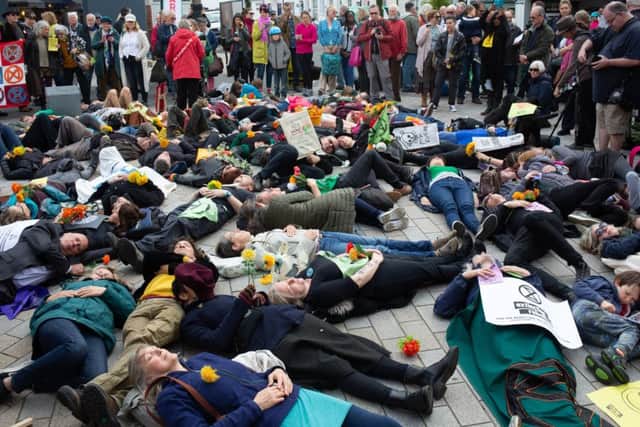 Protestors perform a 'die-in' in Shoreham as part of the Extinction Rebellion protests. Pic: Sean Hawkey SUS-190513-125151001