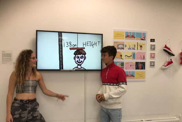 George Ashby and his sister Imogen Ashby in front of her animation at the Oxford Brookes University art show in May.