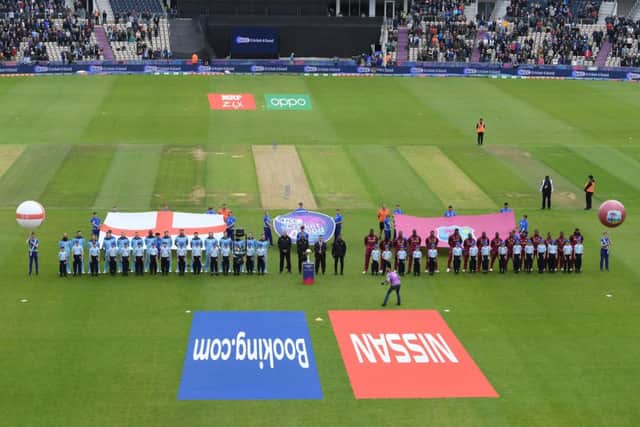 SOUTHAMPTON, ENGLAND - JUNE 14: The teams line up for the anthems ahead of the Group Stage match of the ICC Cricket World Cup 2019 between England and West Indies at The Hampshire Bowl on June 14, 2019 in Southampton, England. (Photo by Mike Hewitt/Getty Images) 775286237