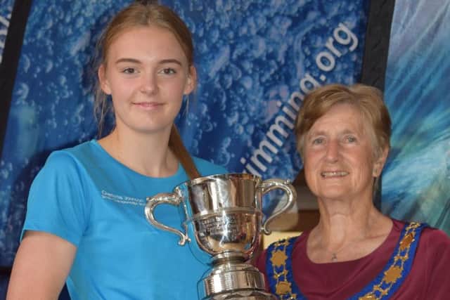 Charlotte Johnson one of her Sussex championships trophies