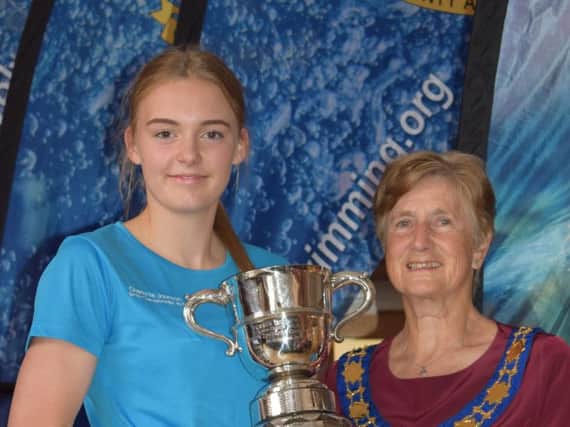 Charlotte Johnson one of her Sussex championships trophies