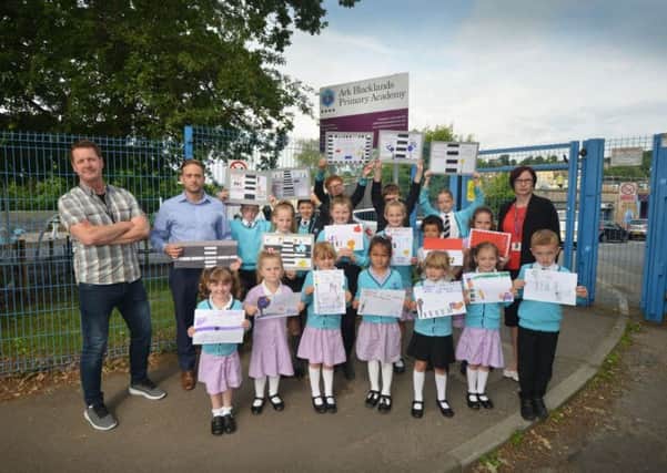 Parents and pupils at the Blacklands Academy are calling for a safe crossing in St Helen's Park Road