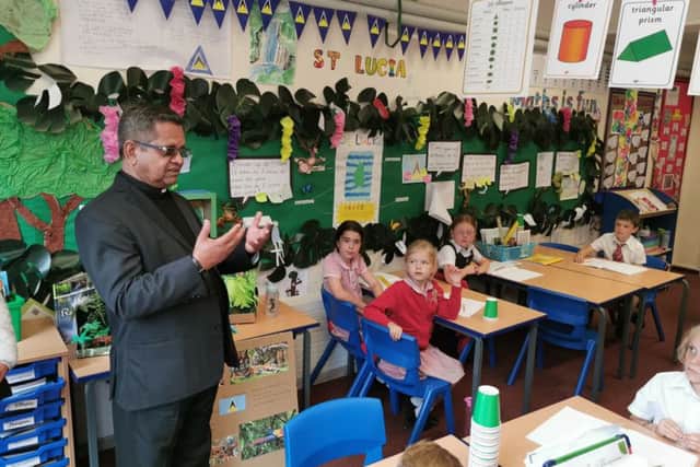Father Jeremias George talking to pupils at Arundel CE Primary School about the work of FEAST (For Education and Social Transformation)