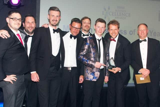 DM1963163a.jpg. Observer Business Excellence Awards 2019 at Hilton Avisford Park, Arundel. Medium Business of the Year winner, LMS Group, presented by Paul Wells MD at Unique Workwear Printing and Embroidery. Photo by Derek Martin Photography.