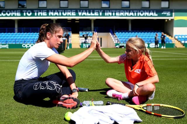 EASTBOURNE, ENGLAND - JUNE 21: Johanna Konta of Great Britain has a surprise hit on court with tennis for kids Ruby prior to the Nature Valley International at Devonshire Park on June 21, 2019 in Eastbourne, United Kingdom. (Photo by Charlie Crowhurst/Getty Images for LTA) *** Local Caption *** Johanna Konta SUS-190622-093409001