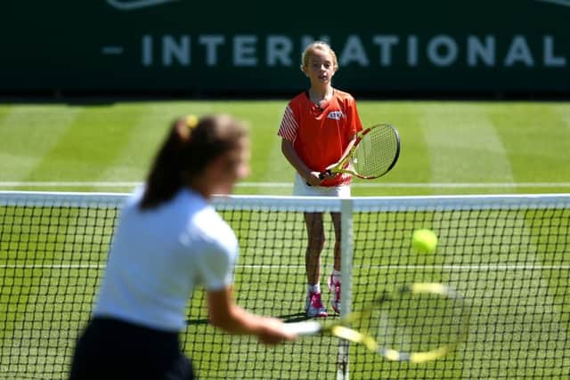 EASTBOURNE, ENGLAND - JUNE 21: Johanna Konta of Great Britain has a surprise hit on court with tennis for kids Ruby prior to the Nature Valley International at Devonshire Park on June 21, 2019 in Eastbourne, United Kingdom. (Photo by Charlie Crowhurst/Getty Images for LTA) *** Local Caption *** Johanna Konta SUS-190622-093332001