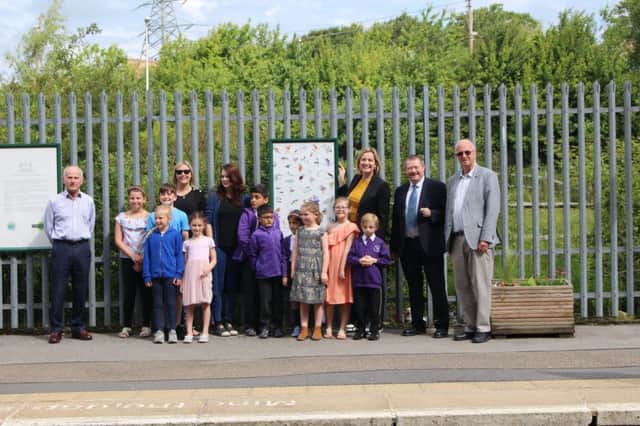 John Spencer, Carly Welch, Anna Beck, Amber Rudd MP, Kevin Boorman and Trevor Davies at Ore station, along with some pupils from Baird Academy who created the artwork at the station. Photo by Harri Boorman.