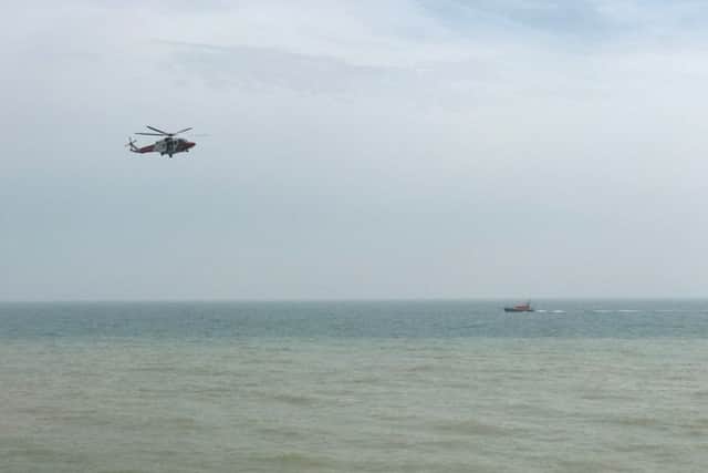 The coastguard helicopter is searching the water near the old bathing pool site