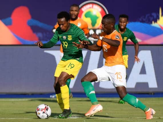 Brighton & Hove Albion forward Percy Tau (left) in action for South Africa against Ivory Coast. Picture courtesy of Getty Images