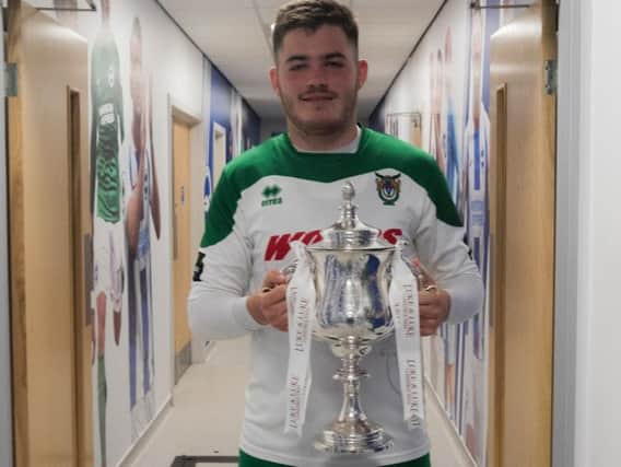 Brad Lethbridge with the Sussex Senior Cup he helped the Rocks win at the Amex / Picture by Tommy McMillan
