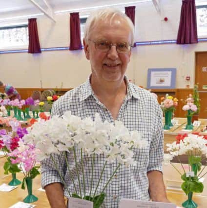 Roger Parsons with his vase of sweet peas, which won the National Sweet Pea Society Bronze Medal
