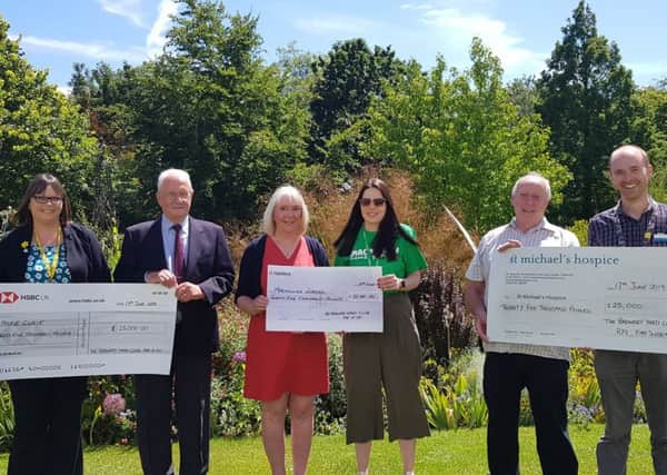 Representatives from  Marie Curie, Macmillan Cancer Support and St Michaels Hospice, each reeive a cheque for £25,000 from members of  The Brewery Yard Club, Rye. SUS-190625-155029001