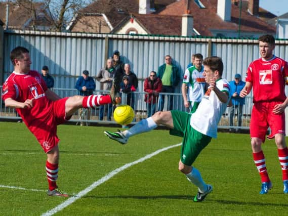 Stuart Green vies for possession in his previous Rocks spell, in a 2015 clash with Leiston / Picture by Tommy McMillan