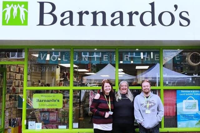 Barnardos store manager JoJo Williams with Sam McKenzie and Chris Gatford