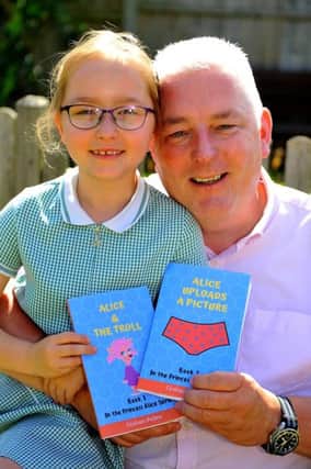 Graham Pullen, Self-published author writes books on internet safety with the help of his daughter Holly-April. Pic Steve Robards SR1917390 SUS-190627-200818001