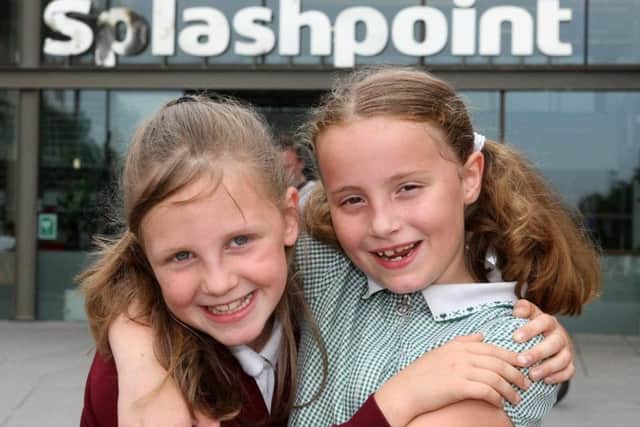 Ruby Davis, eight, and Anna Wallace-Bray, seven, outside Splashpoint Leisure Centre in Brighton Road, Worthing. Picture: Derek Martin Photography