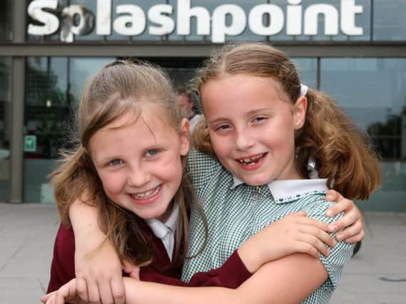 Ruby Davis, eight, and Anna Wallace-Bray, seven, outside Splashpoint Leisure Centre in Brighton Road, Worthing. Picture: Derek Martin Photography