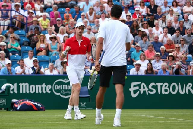 EASTBOURNE, ENGLAND - JUNE 25: Andy Murray of Great Britain and Marcelo Melo of Brazil in action during their mens doubles match against Columbian pair Juan Sebastian Cabal and Robert Farah during day two of the Nature Valley International at Devonshire Park on June 25, 2019 in Eastbourne, United Kingdom. (Photo by Charlie Crowhurst/Getty Images for LTA) 775270853