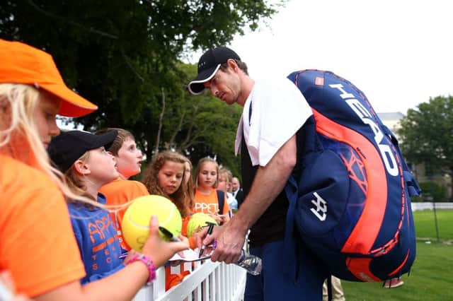 EASTBOURNE, ENGLAND - JUNE 24: Andy Murray of Great Britain signs fans autographs after a practice session during day one of the Nature Valley International at Devonshire Park on June 24, 2019 in Eastbourne, United Kingdom. (Photo by Charlie Crowhurst/Getty Images for LTA) SUS-190626-164752002