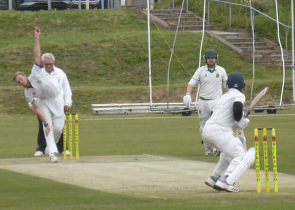 Adam Barton bowling for Hastings Priory Cricket Club against Burgess Hill earlier this month. Picture by Simon Newstead