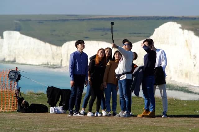 Tourists on Birling Gap cliff edge, photo by Peter Cripps