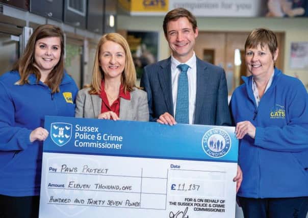Sussex Police and Crime Commissioner Katy Bourne presenting a cheque to Cats Protection