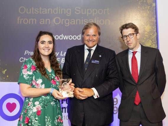 Chanel Birkett and Henry Bass accepting the award on behalf of Goodwood. Credit: RAF Benevolent Fund