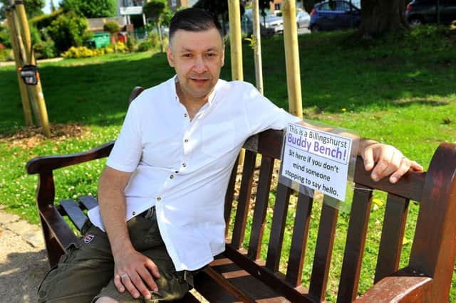 Tony Duffy on the park seat now unofficially designated a buddy bench
