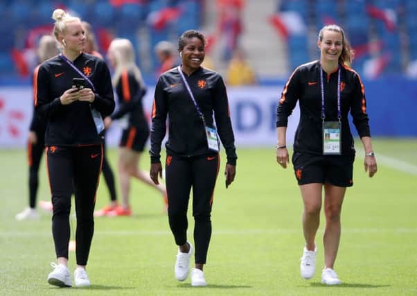 LE HAVRE, FRANCE - JUNE 11: Danique Kerkdijk, Lineth Beerensteyn, and Ellen Jansen of the Netherlands look on during a pitch inspection prior to the 2019 FIFA Women's World Cup France group E match between New Zealand and Netherlands at  on June 11, 2019 in Le Havre, France. (Photo by Alex Grimm/Getty Images) SUS-190107-154746002